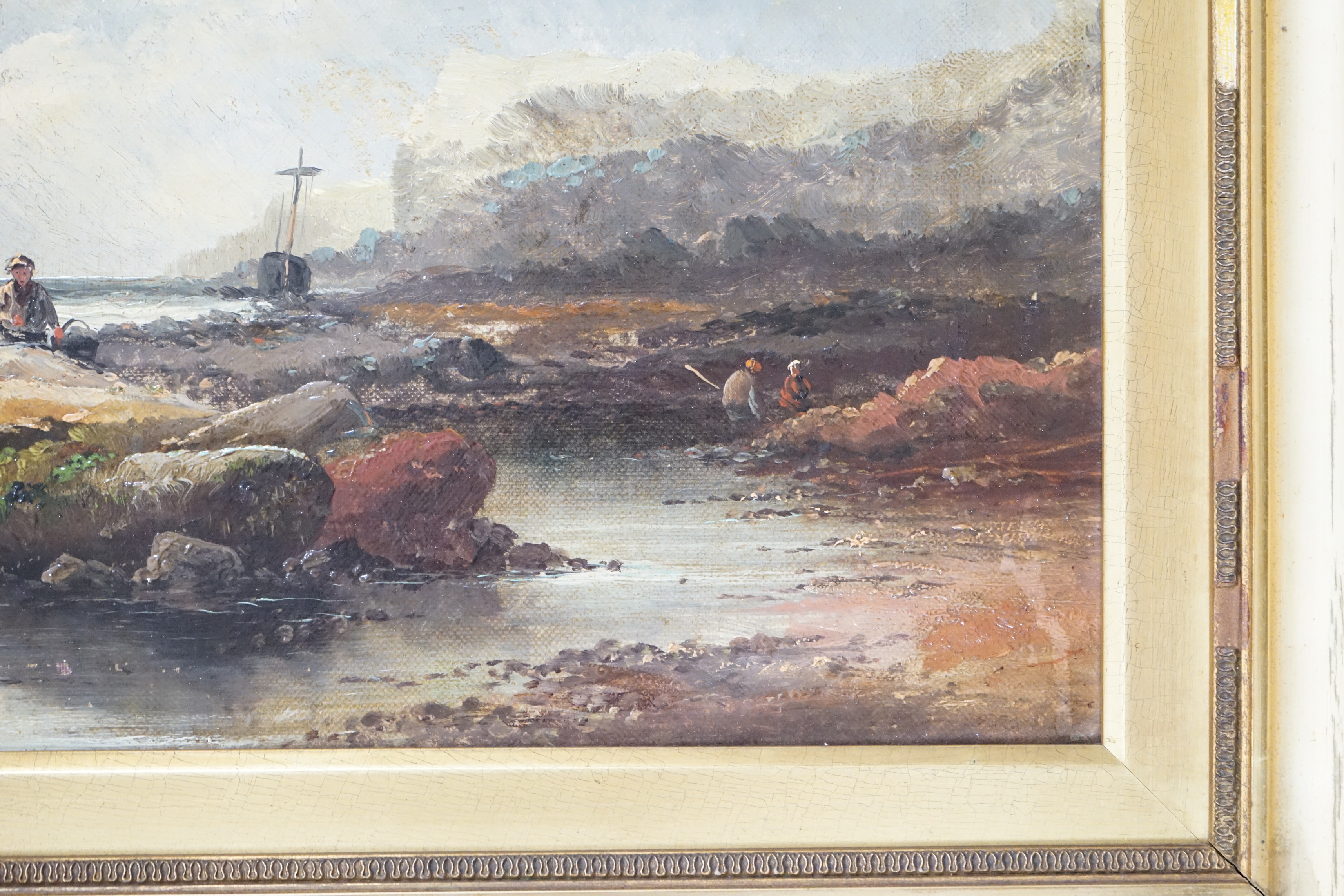Late 19th/early 20th century school, oil on canvas, Coastal scene with figures collecting shellfish, unsigned, 29 x 44cm